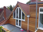 Machine made clay tile roofing with hand made effect from Harris Roofing Limited.