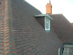 Machine made clay tile roofing in the New Forest from Harris Roofing Limited.
