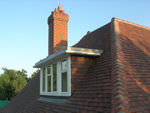 Machine made clay tile roofing in the New Forest from Harris Roofing Limited.