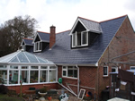 Man made slate tiling in the New Forest from Harris Roofing Limited.