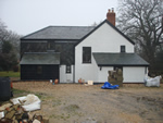 Reroofing with natural slate tiles throughout the New Forest from Harris Roofing Limited.