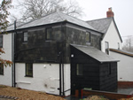 Reroofing with natural slate tiles throughout the New Forest from Harris Roofing Limited.
