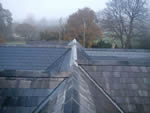 Reroofing with natural slate tiles throughout the New Forest from Harris Roofing Limited.