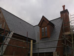 Reroofing with natural slate tiles throughout the New Forest from Harris Roofing Limited.