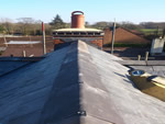 Reroofing with natural slate tiles throughout the New Forest from Harris Roofing Limited.