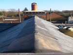 Reroofing with natural slate tiles throughout the New Forest from Harris Roofing Limited.