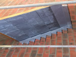 Reroofing with natural slate tiles throughout the New Forest from Harris Roofing Limited.
