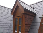 Reroofing with natural slate tiles throughout the New Forest from Harris Roofing Limited.