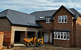 New slate tiles fitted to new build house