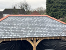 Reroofing with handmade tiles, incorporation of flat roof system